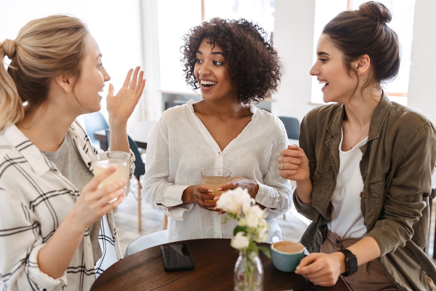 Happy Young Women Friends Having Coffee Break